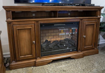 Channley - XL TV Stand With Fireplace Option - Brown by Ashley – TV Stands