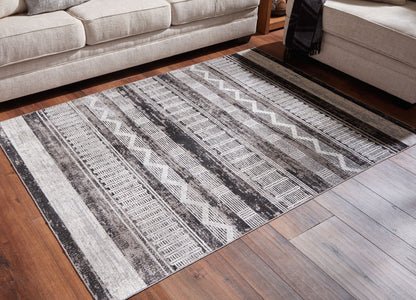 Henchester - 5' x 7' Rug - Multi by Ashley – view 4