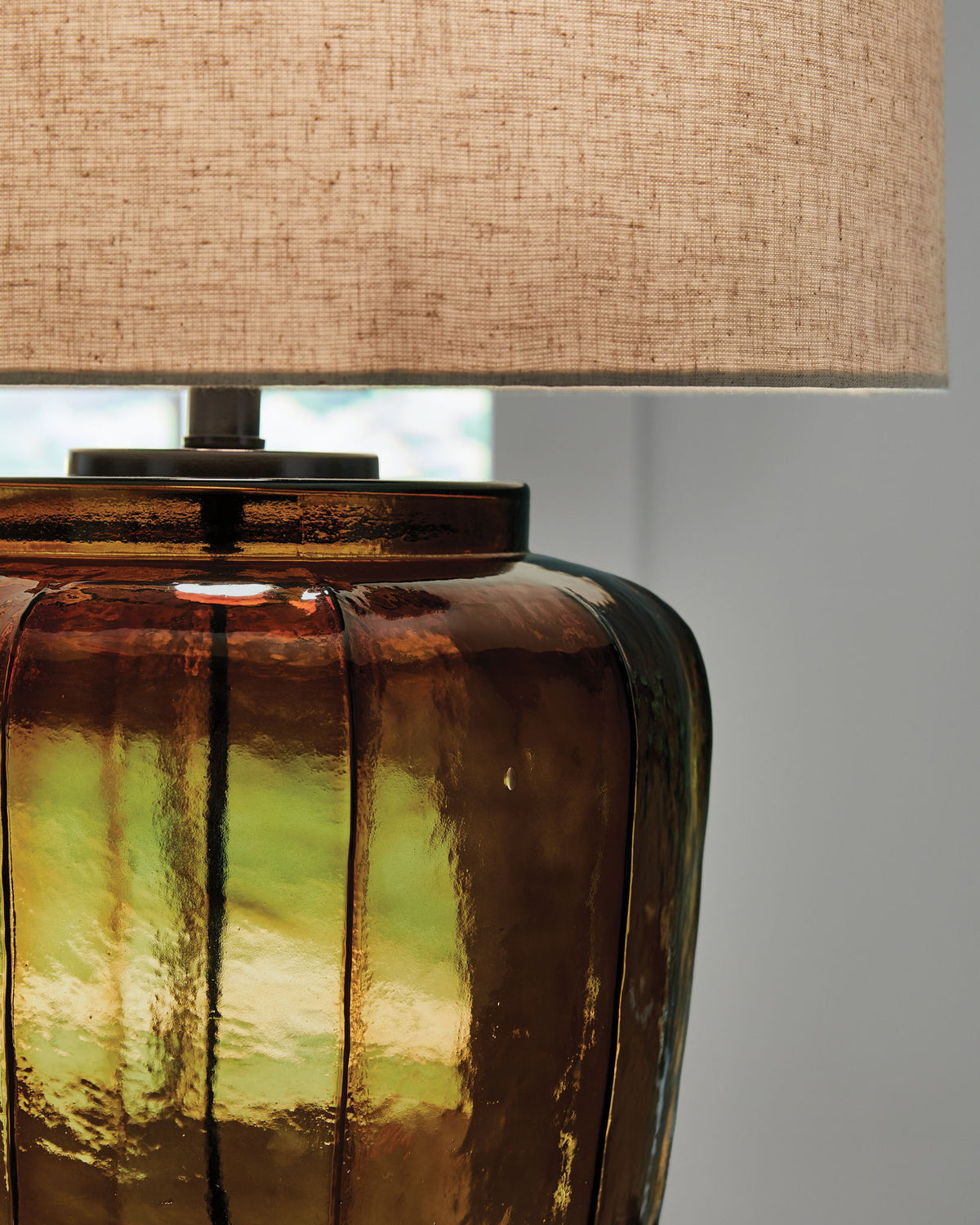 Bainmore - Glass Table Lamp - Amber by Ashley – view 2