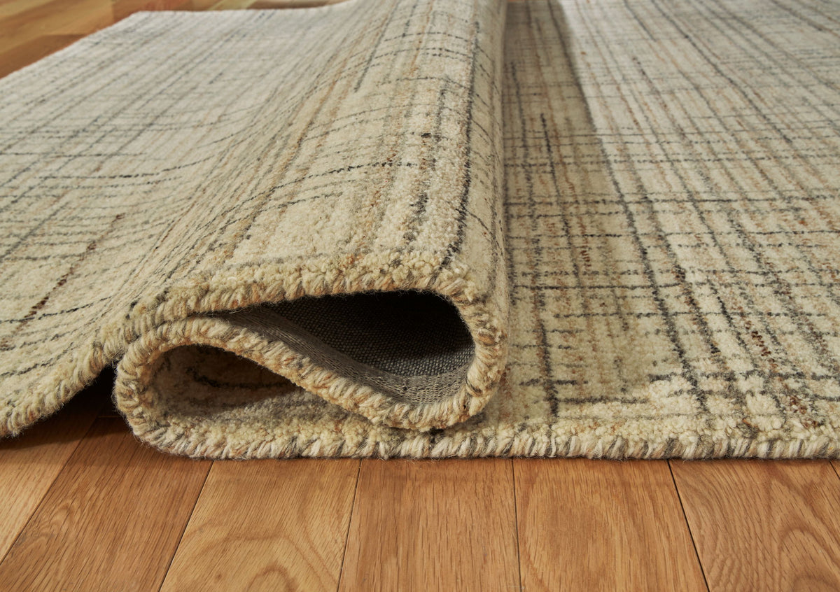 Janston - 5' x 7' Rug - Ivory / Gray / Tan by Ashley – view 3