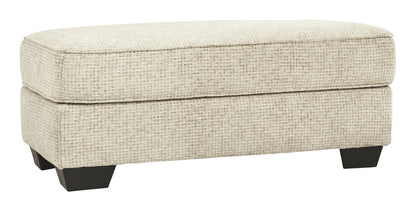 Monaghan - Ottoman - Sandstone by Ashley – Upholstered Ottomans