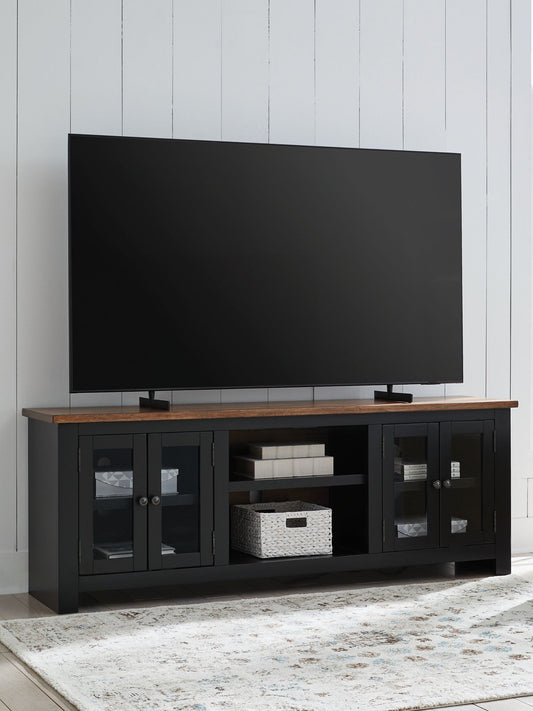 Wildenauer - XL TV Stand With Fireplace Option - Brown / Black by Ashley – TV Stands