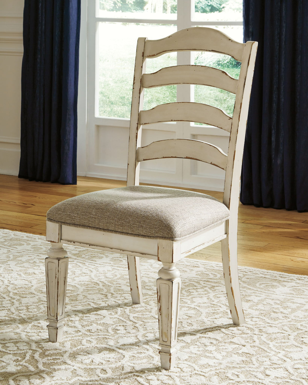 Realyn - Dining UPH Side Chair (Set of 2) - Ladderback - Chipped White by Ashley – view 4
