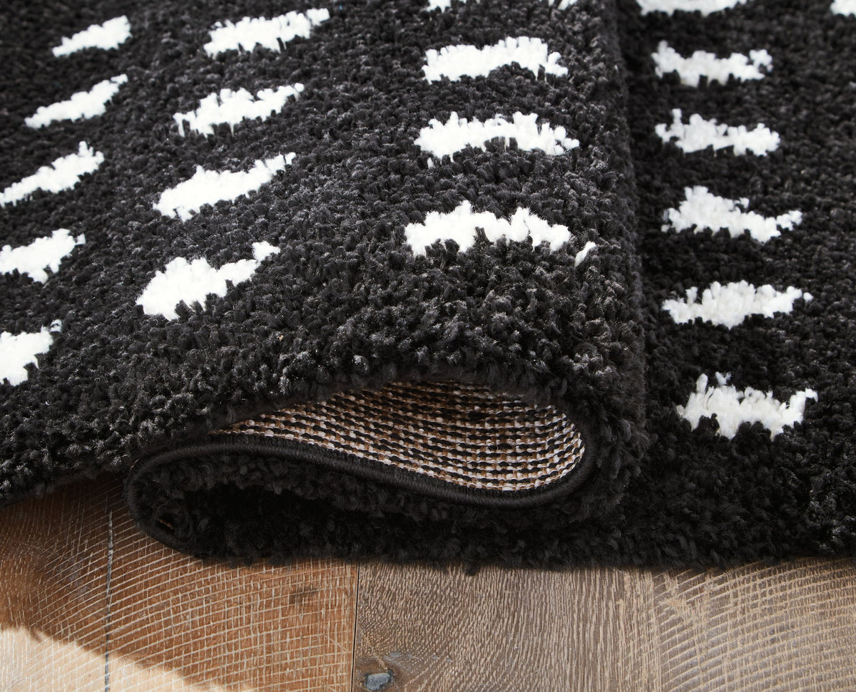 Minston - 5' x 7' Rug - Black / White by Ashley – view 4