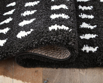 Minston - 5' x 7' Rug - Black / White by Ashley – view 4